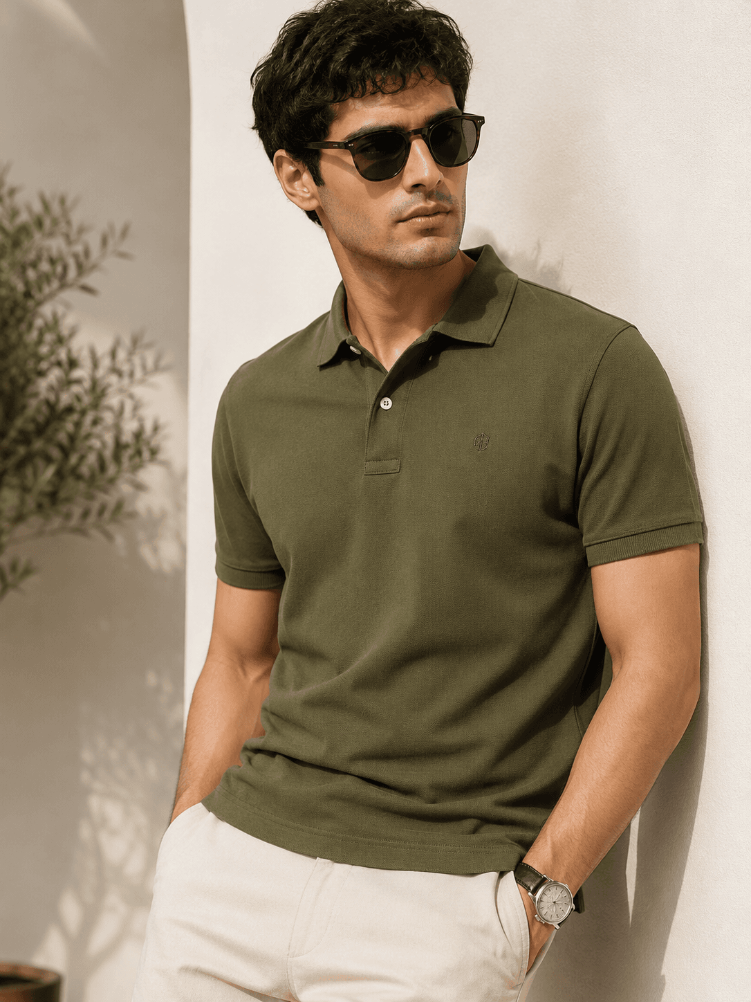 Man in white shirt against a clean background